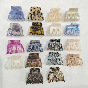 Nestled among strands of hair, this hairpin gives the impression of a little creature lounging comfortably with its paws tucked in. The detailed sculpting of each paw brings them to life, allowing you to imagine the soft pads under the bronze toes.